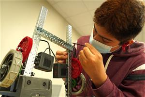 man working with Robotics 